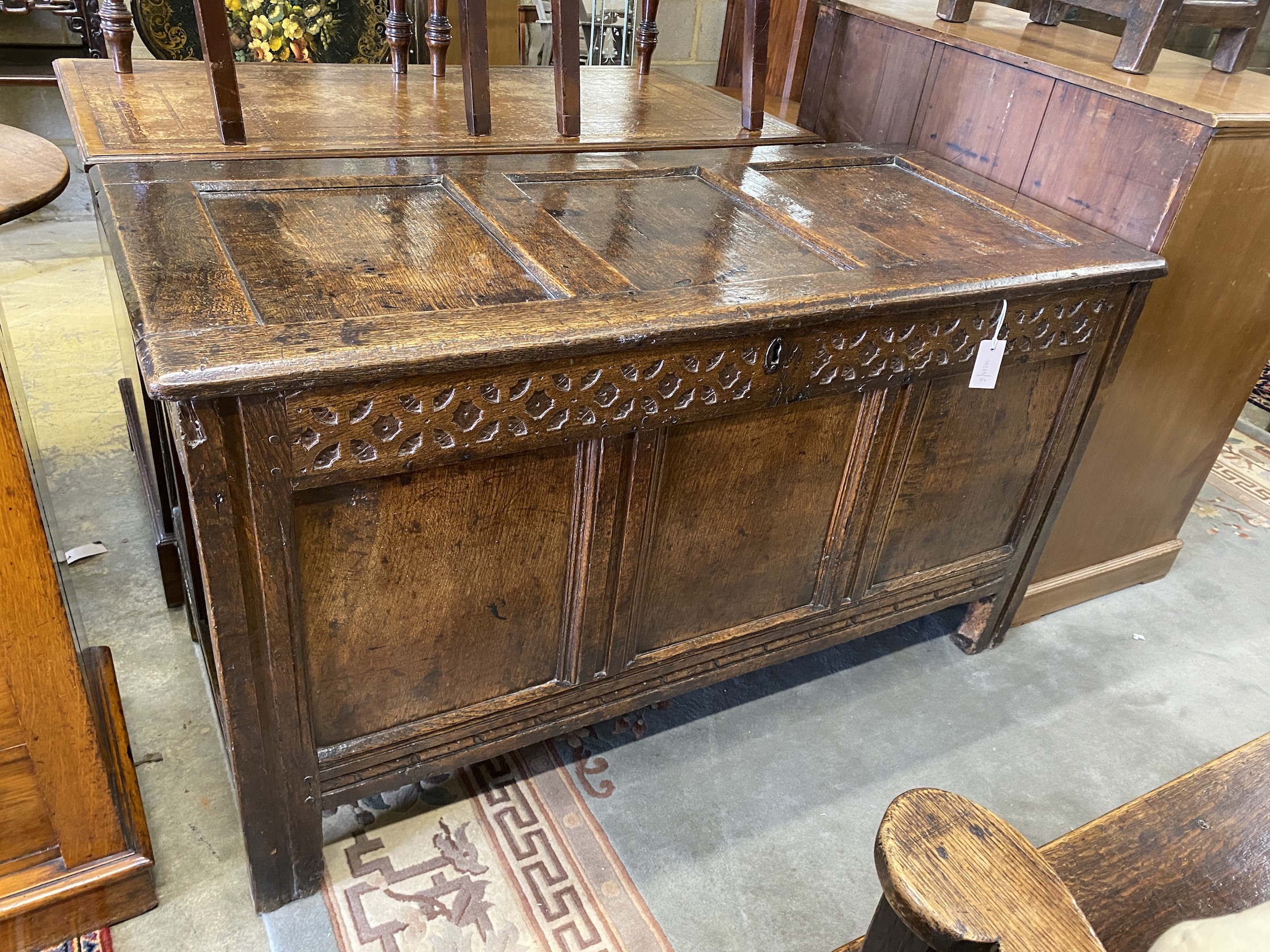 A late 17th /early 18th century carved panelled oak coffer, length 135cm, depth 59cm, height 75cm
